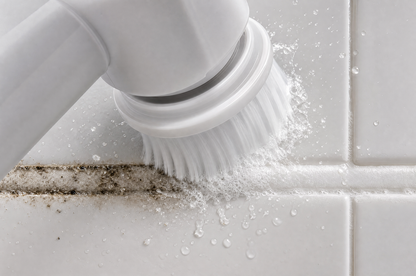 Close-up of the AquaScrub Pro brush head cleaning grout, before-and-after